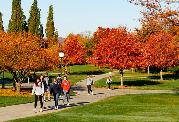 image of students walking campus in the fall